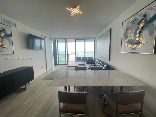 a living room with a couch and a fireplace