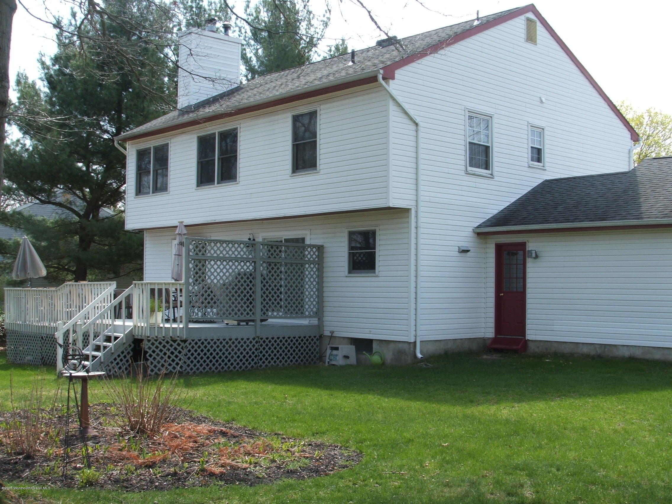 65 Chelsea Road Jackson, NJ 08527 - Photo 23 of 24 a front view of a house with garden
