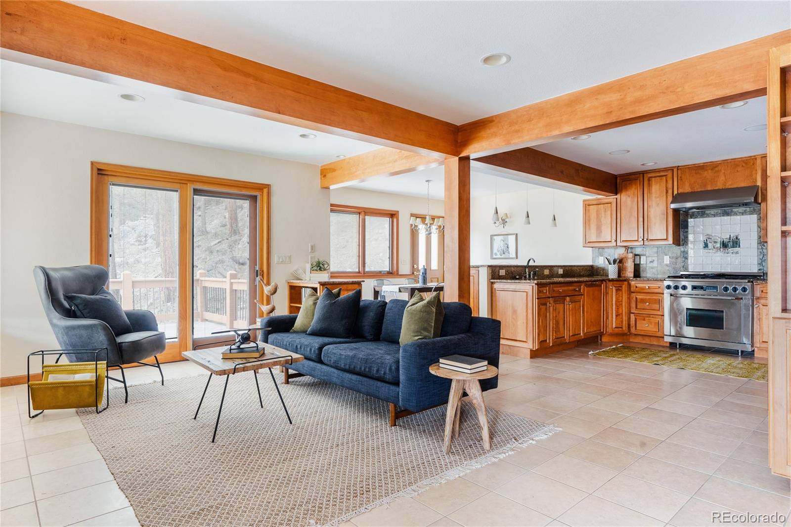 34187 Cactus Drive Evergreen, CO 80439 - Photo 12 of 39 a living room with furniture and kitchen view