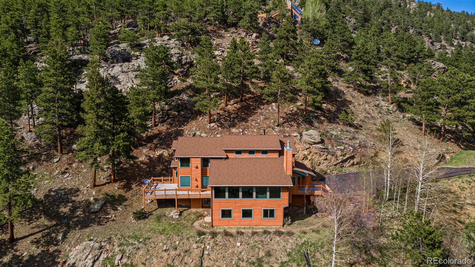 34187 Cactus Drive Evergreen, CO 80439 - Photo 2 of 39 aerial view of a house with large trees