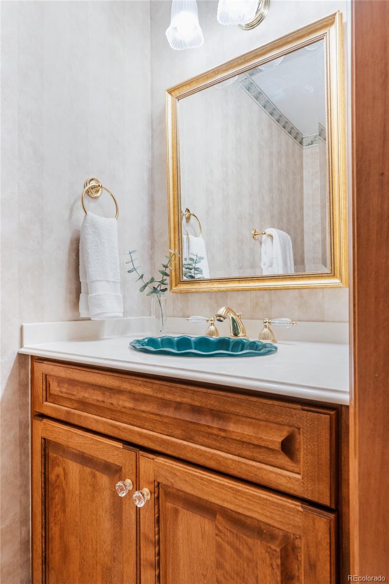 34187 Cactus Drive Evergreen, CO 80439 - Photo 21 of 39 a bathroom with a sink and a mirror