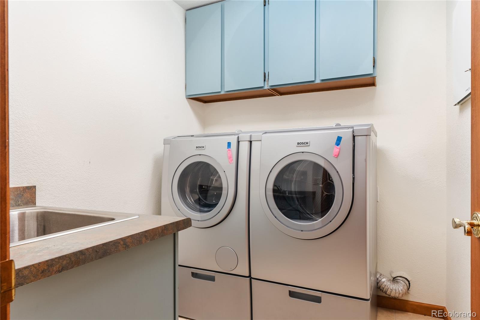 34187 Cactus Drive Evergreen, CO 80439 - Photo 22 of 39 a utility room with dryer and washer