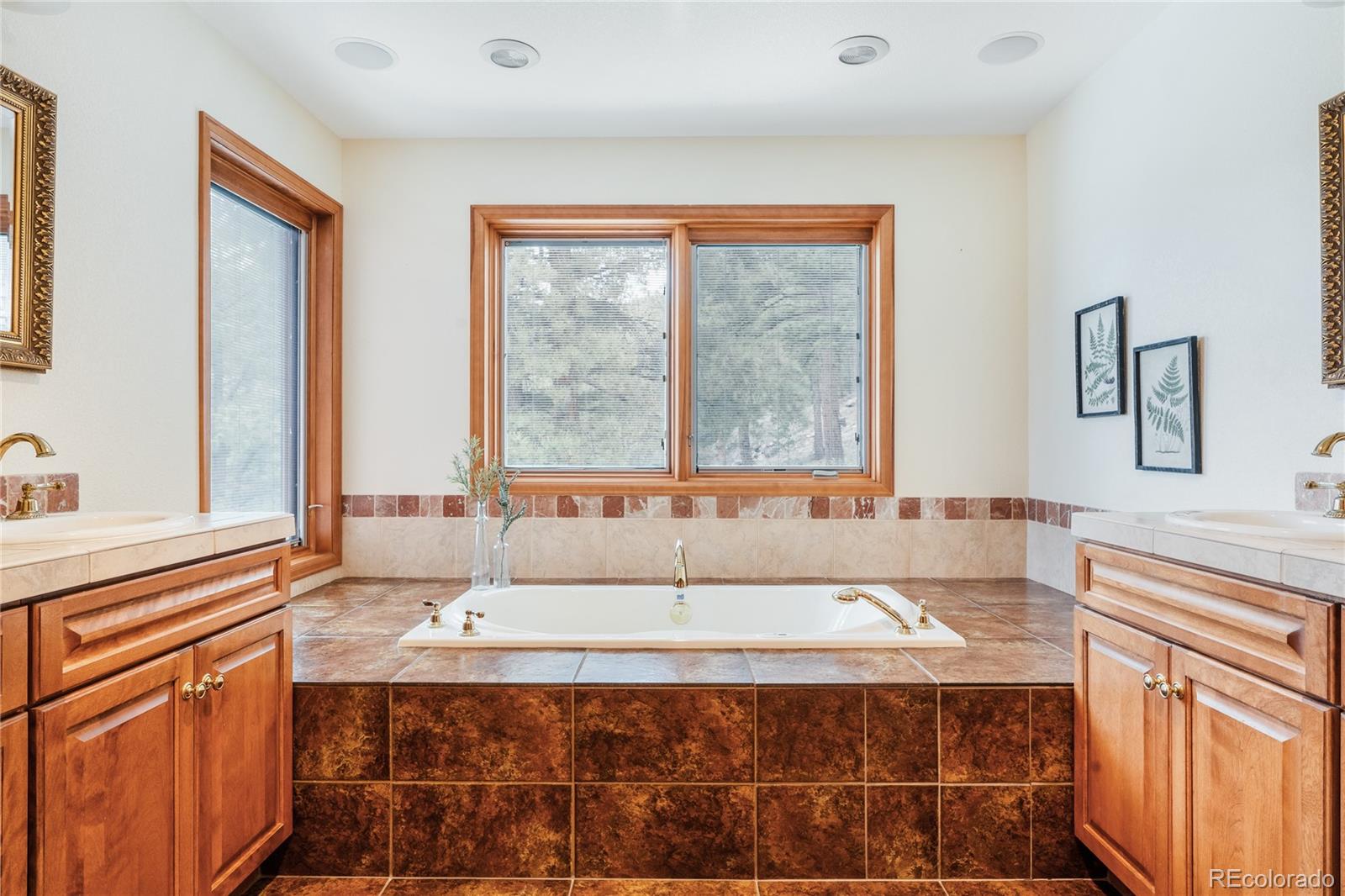 34187 Cactus Drive Evergreen, CO 80439 - Photo 30 of 39 a living room with a large window couches and fireplace