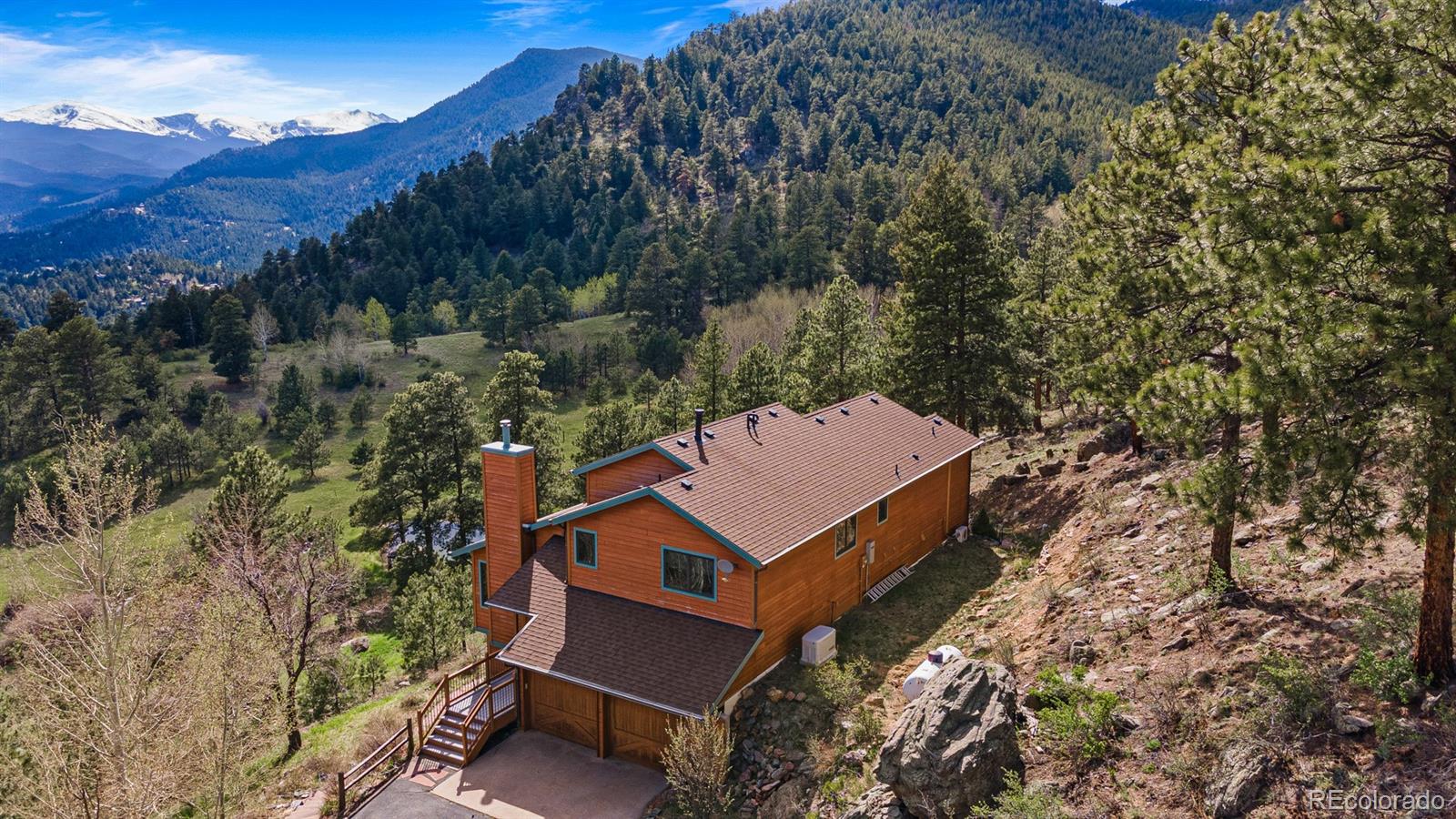 34187 Cactus Drive Evergreen, CO 80439 - Photo 36 of 39 an aerial view of a house with a yard