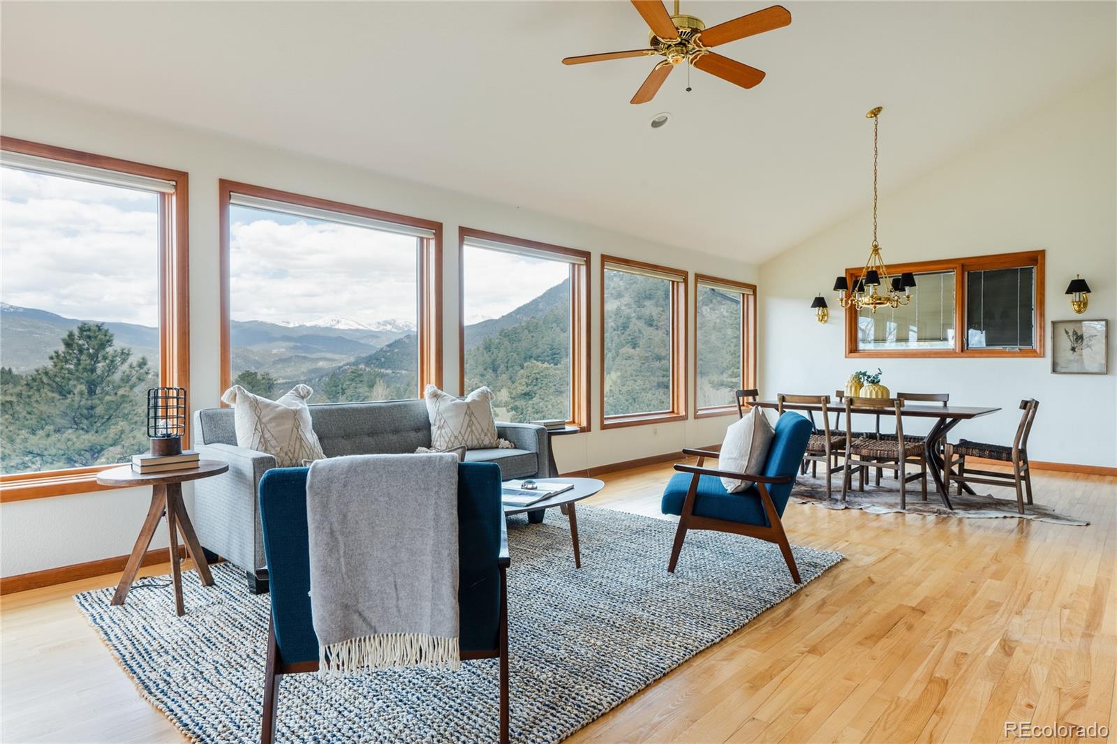 34187 Cactus Drive Evergreen, CO 80439 - Photo 4 of 39 a living room with furniture and a large window