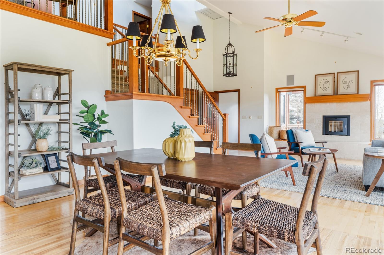 34187 Cactus Drive Evergreen, CO 80439 - Photo 10 of 39 a dining room with furniture a chandelier and wooden floor
