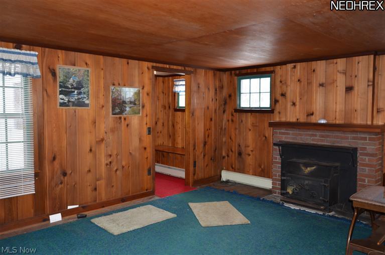 16247 Thompson Road Thompson, OH 44086 - Photo 8 of 21 Woodburner fireplace in Living Room
