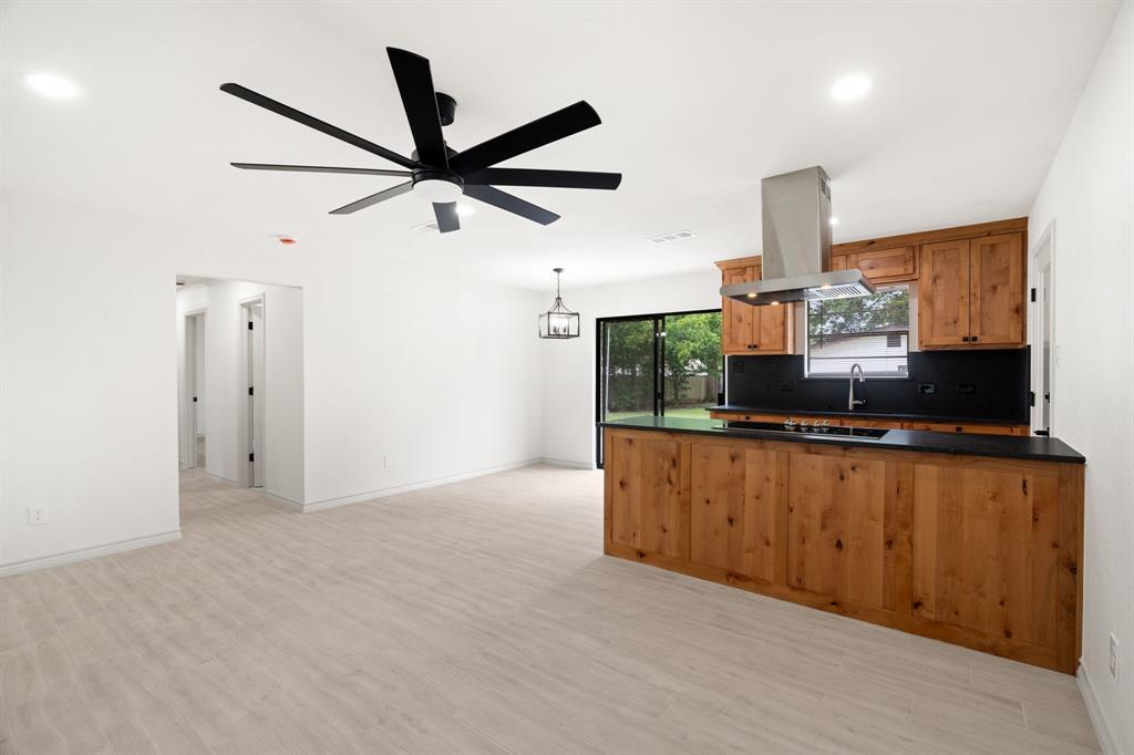 103 North Summit Street Red Oak, TX 75154 - Photo 12 of 30 a kitchen with stainless steel appliances a refrigerator and sink