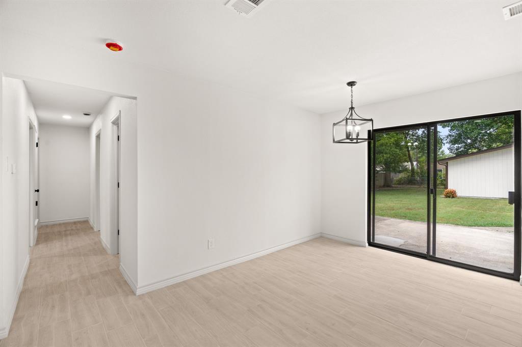 103 North Summit Street Red Oak, TX 75154 - Photo 14 of 30 a view of an empty room with glass door and garden