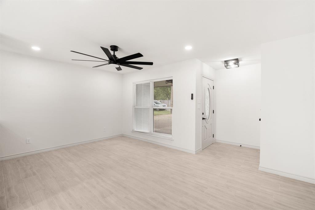 103 North Summit Street Red Oak, TX 75154 - Photo 17 of 30 an empty room with window and ceiling fan