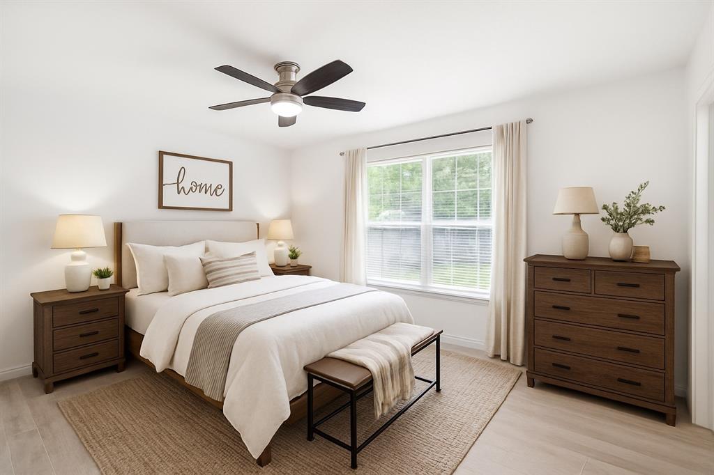 103 North Summit Street Red Oak, TX 75154 - Photo 5 of 30 a bedroom with a bed and a window