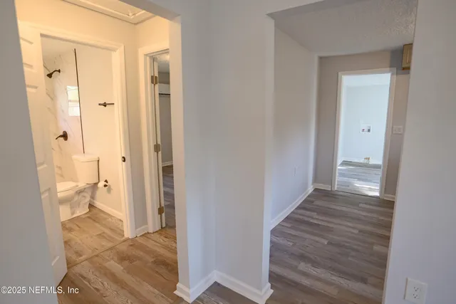 a view of a bathroom with a shower and a toilet