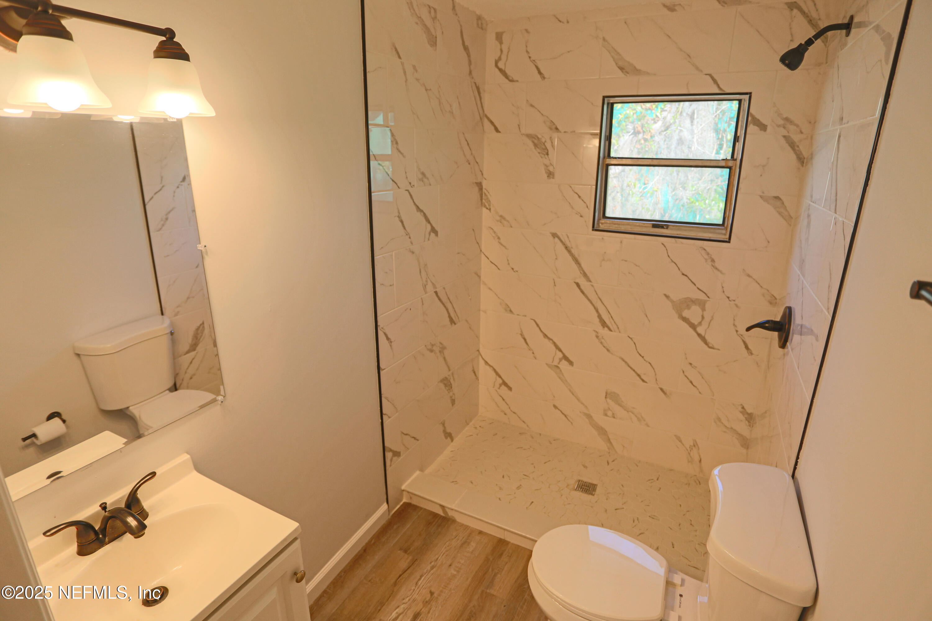 505 North 9th Street Palatka, FL 32177 - Photo 21 of 29 a bathroom with a sink toilet and shower