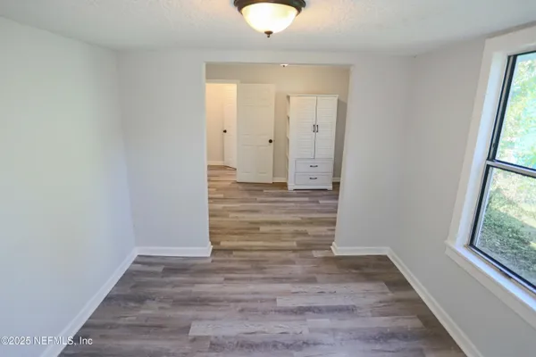 a view of entryway with wooden floor
