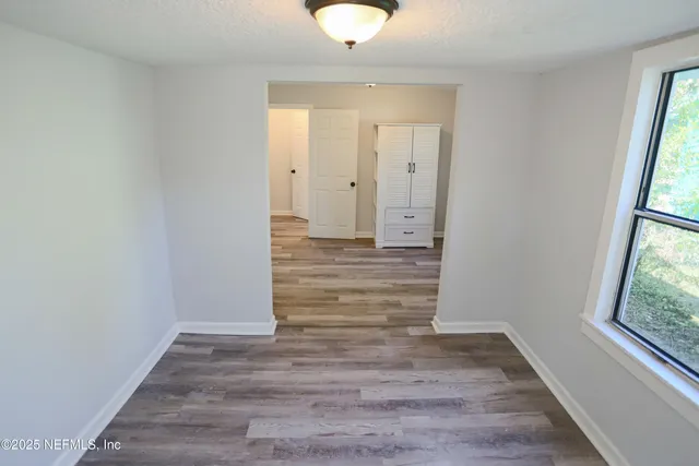 a view of entryway with wooden floor