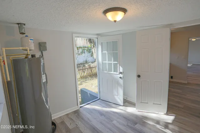 a view of entryway with wooden floor