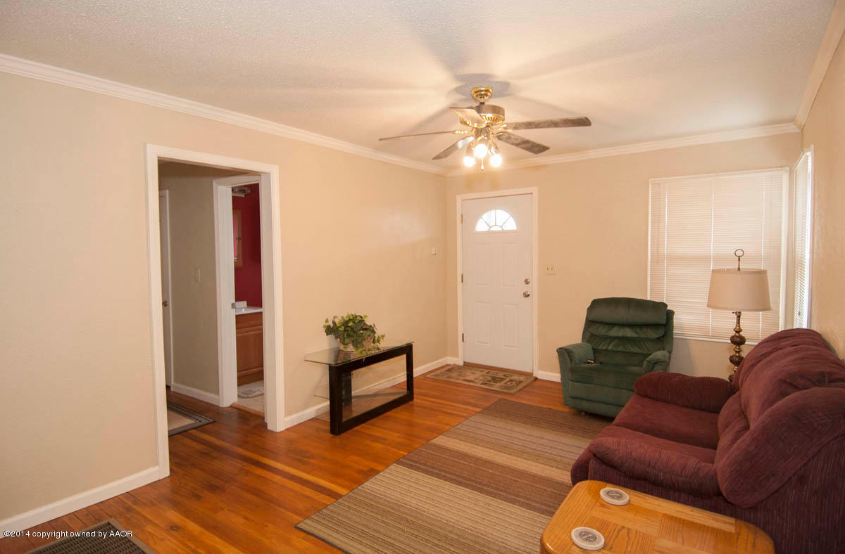 4125 South Ong Street Amarillo, TX 79110 - Photo 5 of 20 a living room with furniture and wooden floor