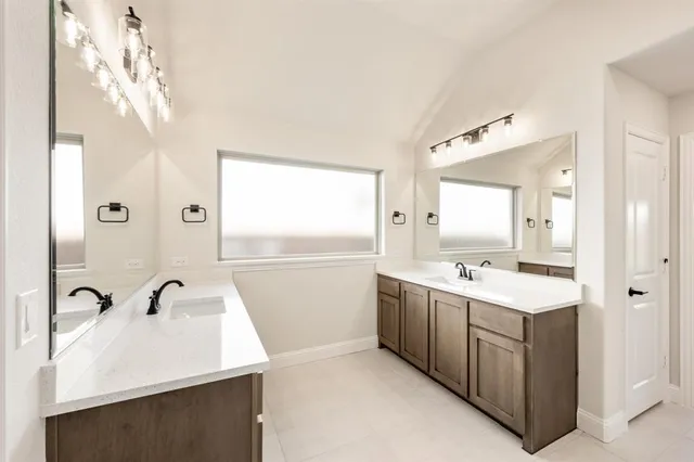 a white bath tub sitting next to a shower