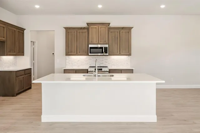 a view of kitchen with wooden floor
