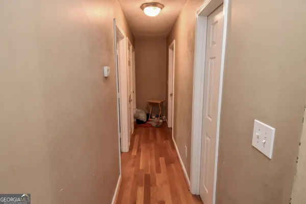 a bathroom with a sink toilet and mirror
