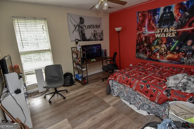 a bedroom with a bed and furniture