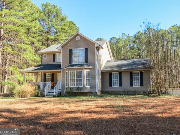 front view of a house with a yard