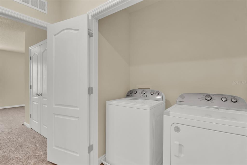 1238 Lido Drive Howey-in-the-Hills, FL 34737 - Photo 11 of 27 a utility room with dryer and washer