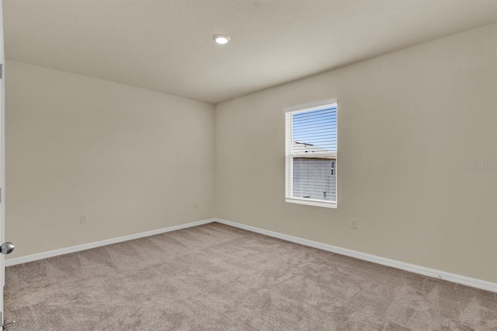 1238 Lido Drive Howey-in-the-Hills, FL 34737 - Photo 14 of 27 an empty room with a window