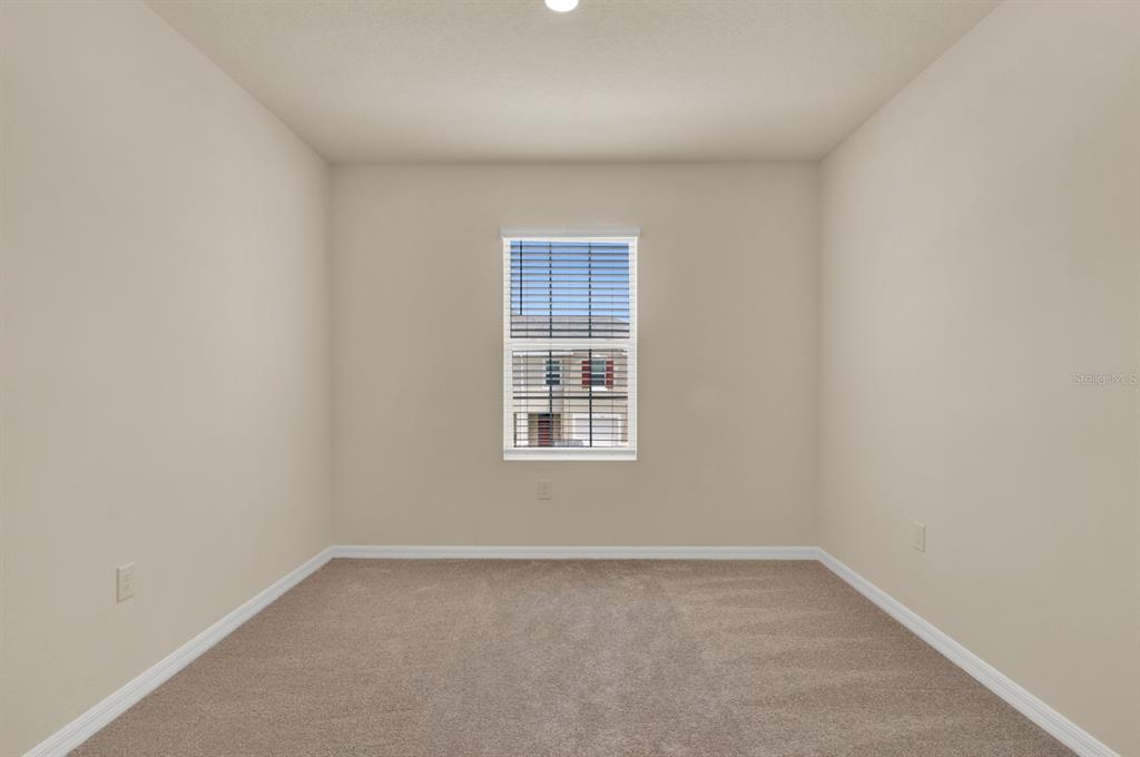 1238 Lido Drive Howey-in-the-Hills, FL 34737 - Photo 18 of 27 an empty room with a window