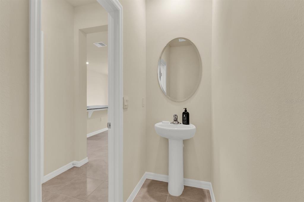 1238 Lido Drive Howey-in-the-Hills, FL 34737 - Photo 20 of 27 a bathroom with a sink and a mirror