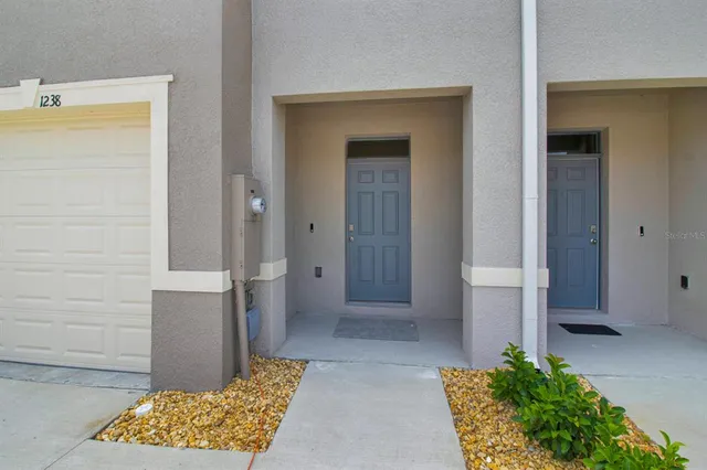 a view of bathroom with a potted plant and a sink