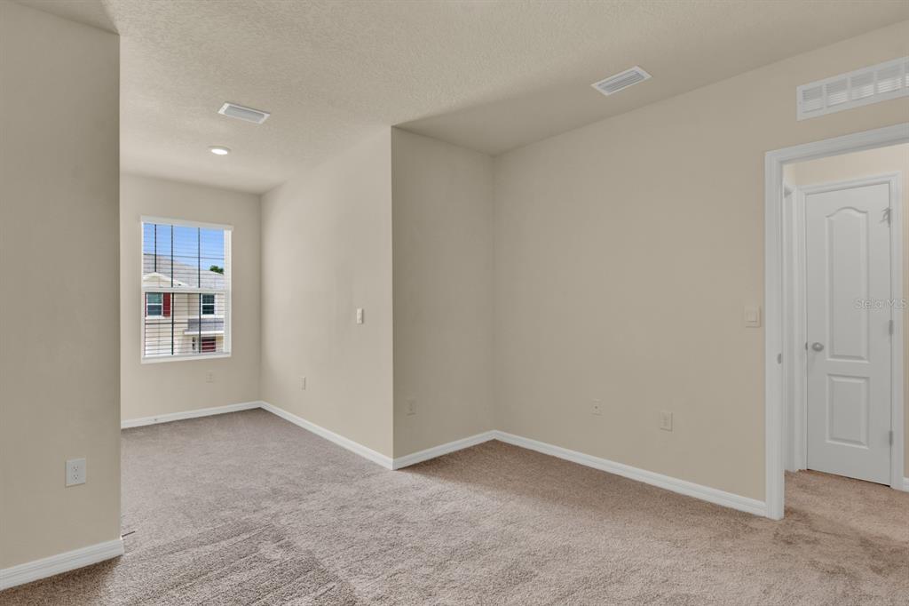 1238 Lido Drive Howey-in-the-Hills, FL 34737 - Photo 24 of 27 an empty room with windows