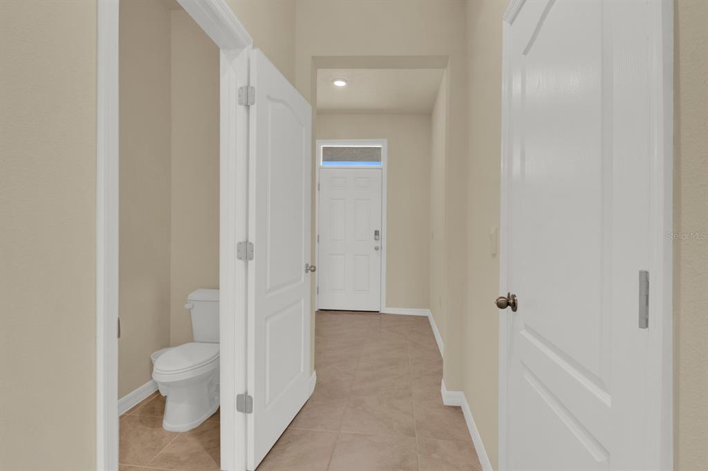 1238 Lido Drive Howey-in-the-Hills, FL 34737 - Photo 9 of 27 a bathroom with a granite countertop toilet and a shower