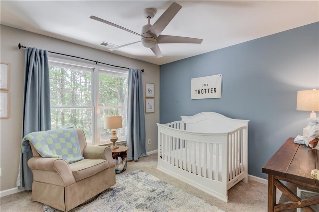 2310 Olde Hickory Place Monroe, GA 30656 - Photo 26 of 46 a bedroom with furniture and a large window