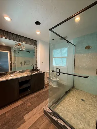 a room with a large mirror and furniture