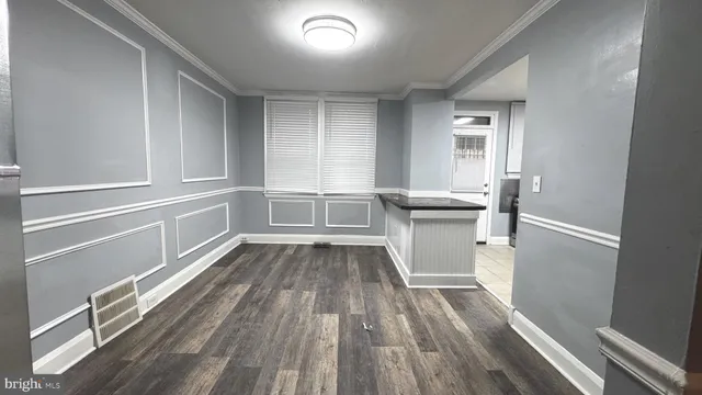 a view of a kitchen from the hallway