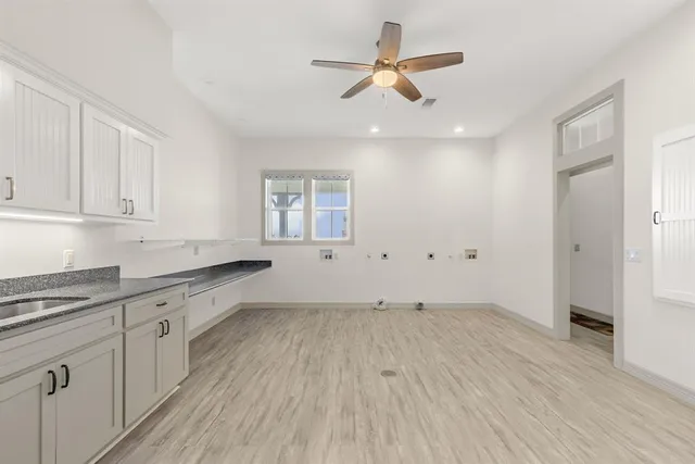 a view of a kitchen with electric appliances