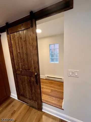 a view of entryway with wooden floor