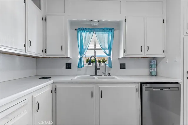 a kitchen with appliances cabinets and a counter top space