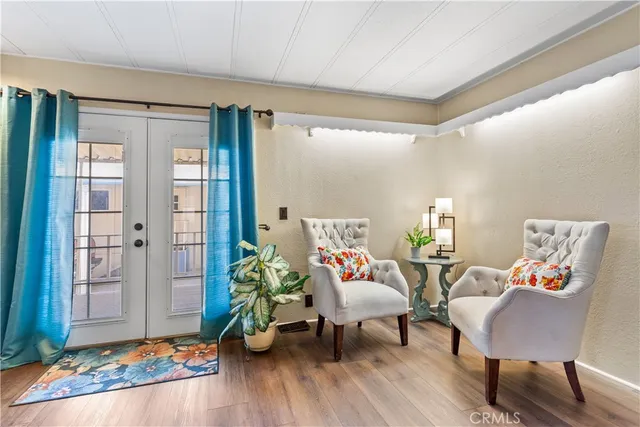 a bedroom with a bed table and a window