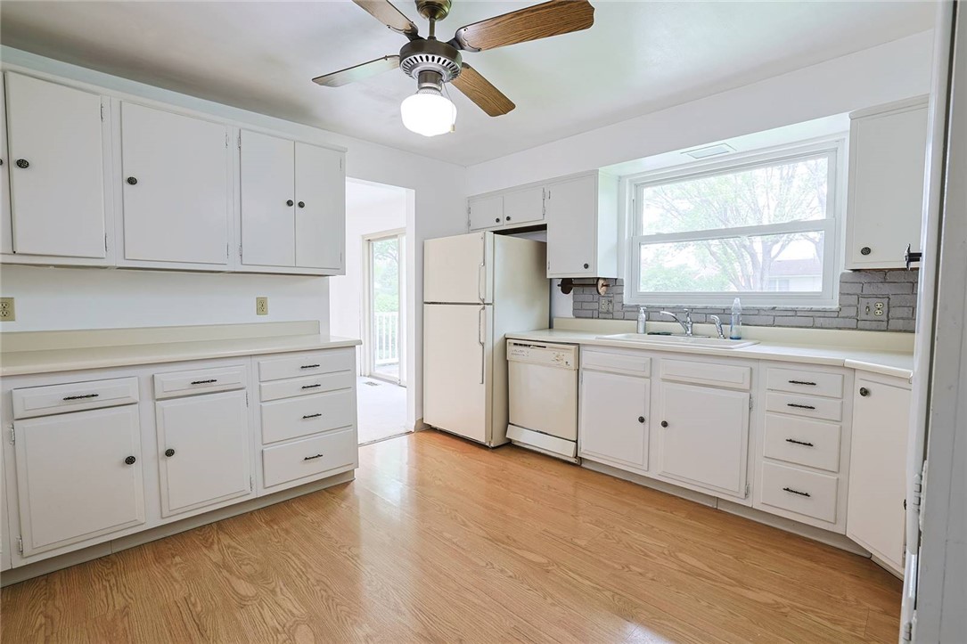 452 Cookston Avenue Springfield, OH 45503 - Photo 11 of 34 Bright and airy, this kitchen features wood flooring and ample cabinetry for comfortable living.