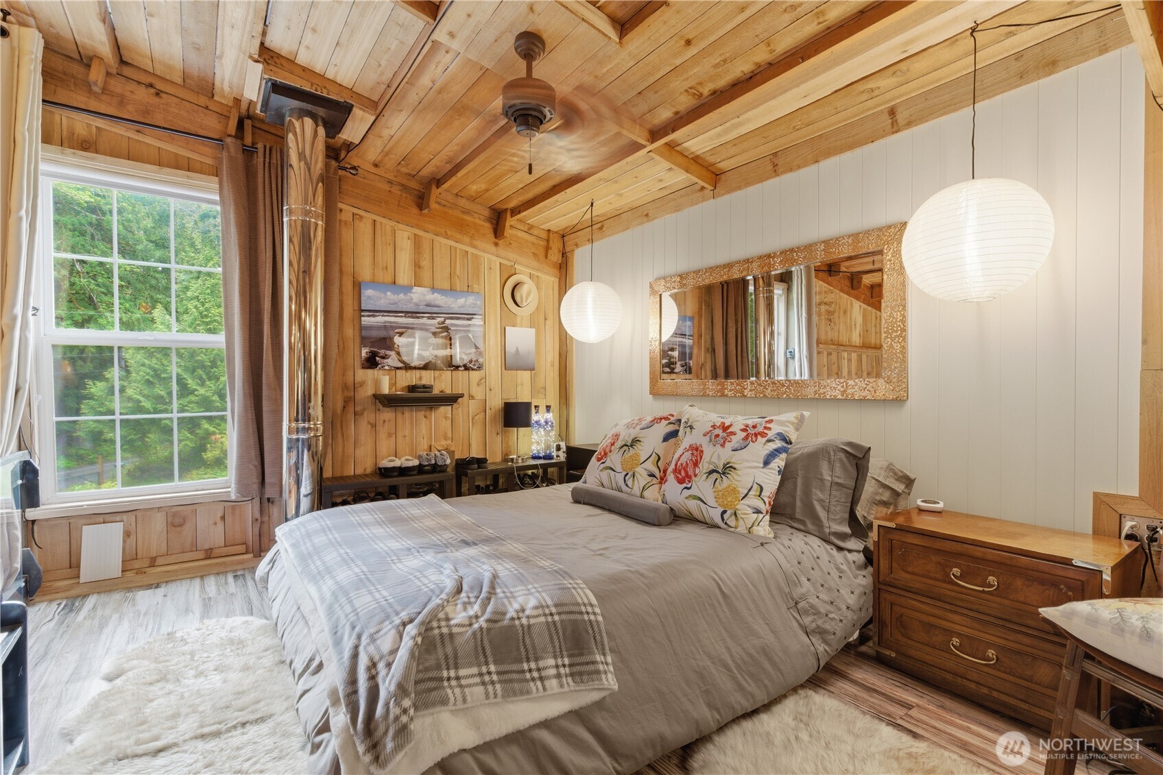 3320 Duckabush Road Brinnon, WA 98320 - Photo 17 of 38 a bedroom with a bed and wooden floor