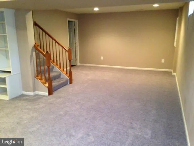 a view of an empty room with stairs
