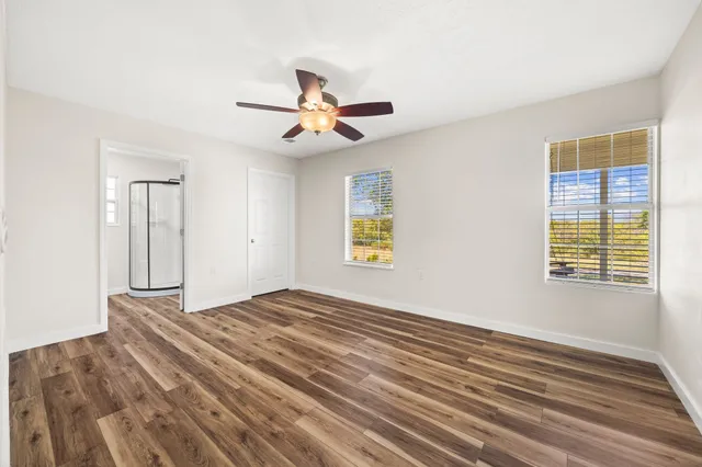 a view of a house with yard and sitting area