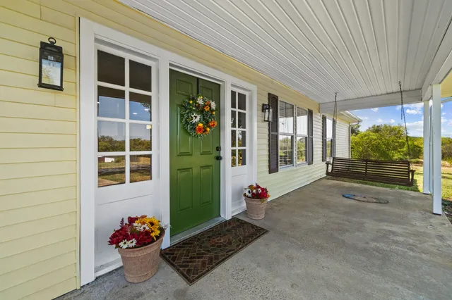 a kitchen with stainless steel appliances a refrigerator sink and cabinets