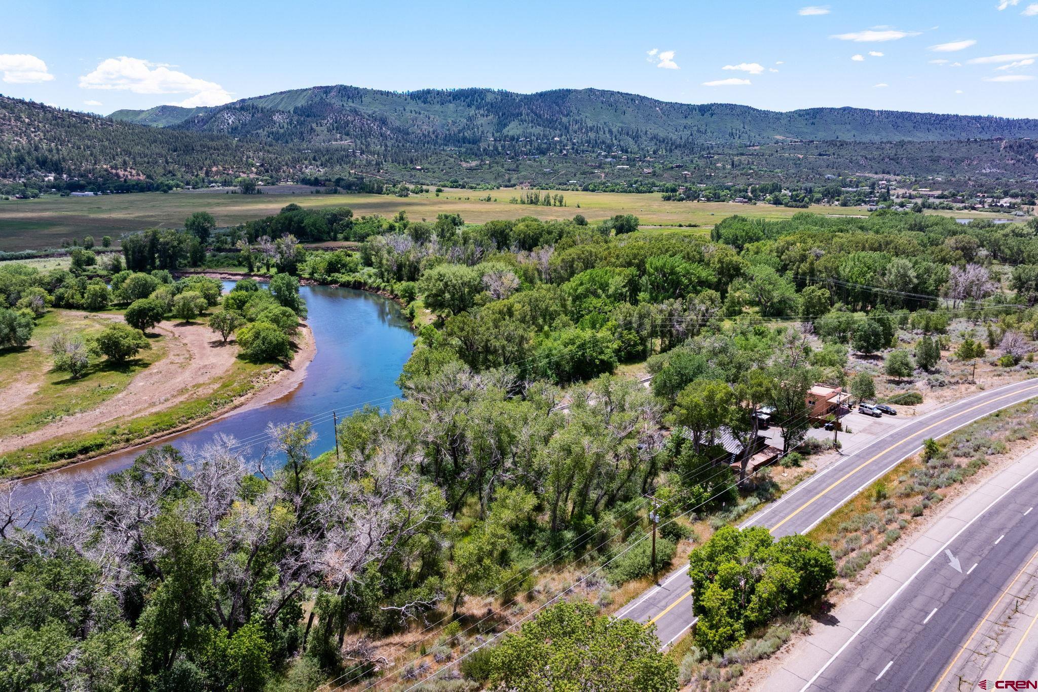 1110 Animas View Drive Durango, CO 81301 - Photo 7 of 32 an aerial view of a house with outdoor space and a lake view