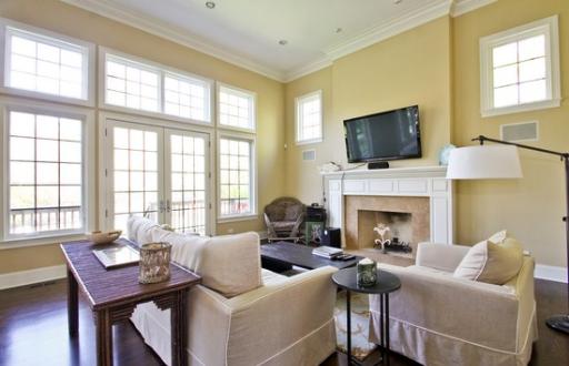 2360 Greenview Road Northbrook, IL 60062 - Photo 2 of 12 a living room with furniture a flat screen tv and a fireplace