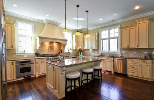 2360 Greenview Road Northbrook, IL 60062 - Photo 3 of 12 a kitchen with a stove a sink a window and chairs