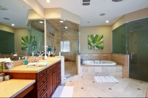 2360 Greenview Road Northbrook, IL 60062 - Photo 9 of 12 a bathroom with a double vanity sink tub and mirror