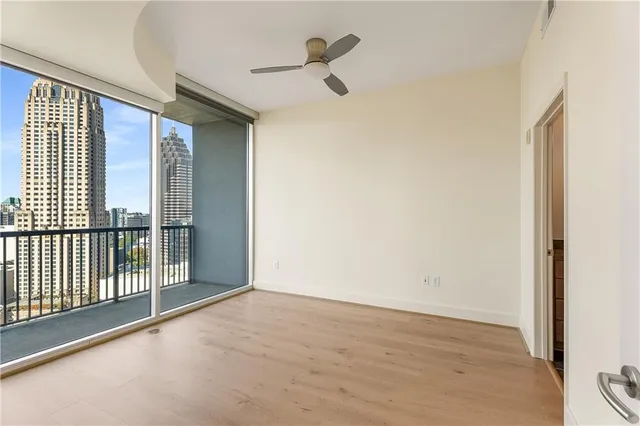 a view of an empty room with glass door